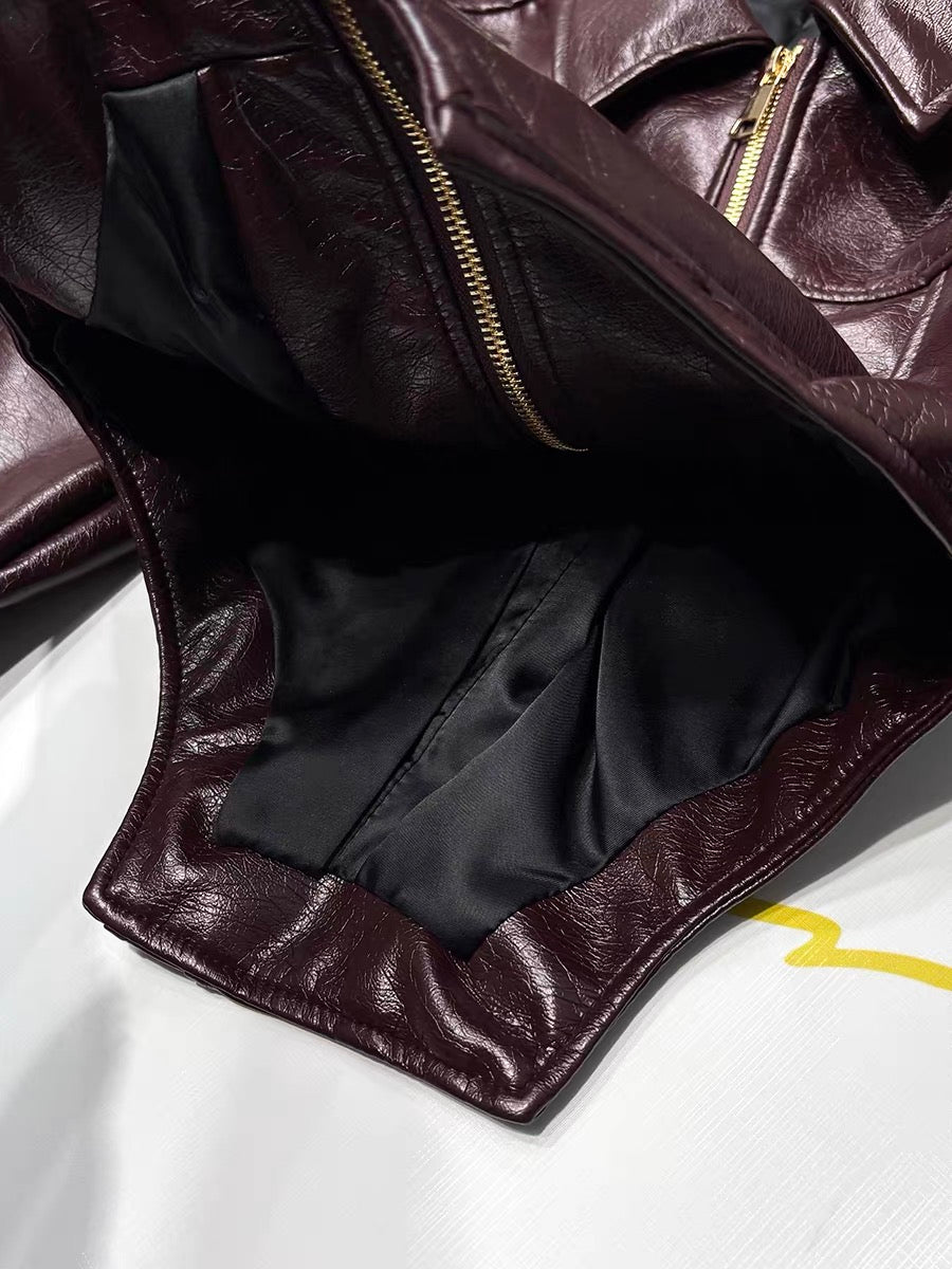 Burgundy faux leather moto jacket black lining detail