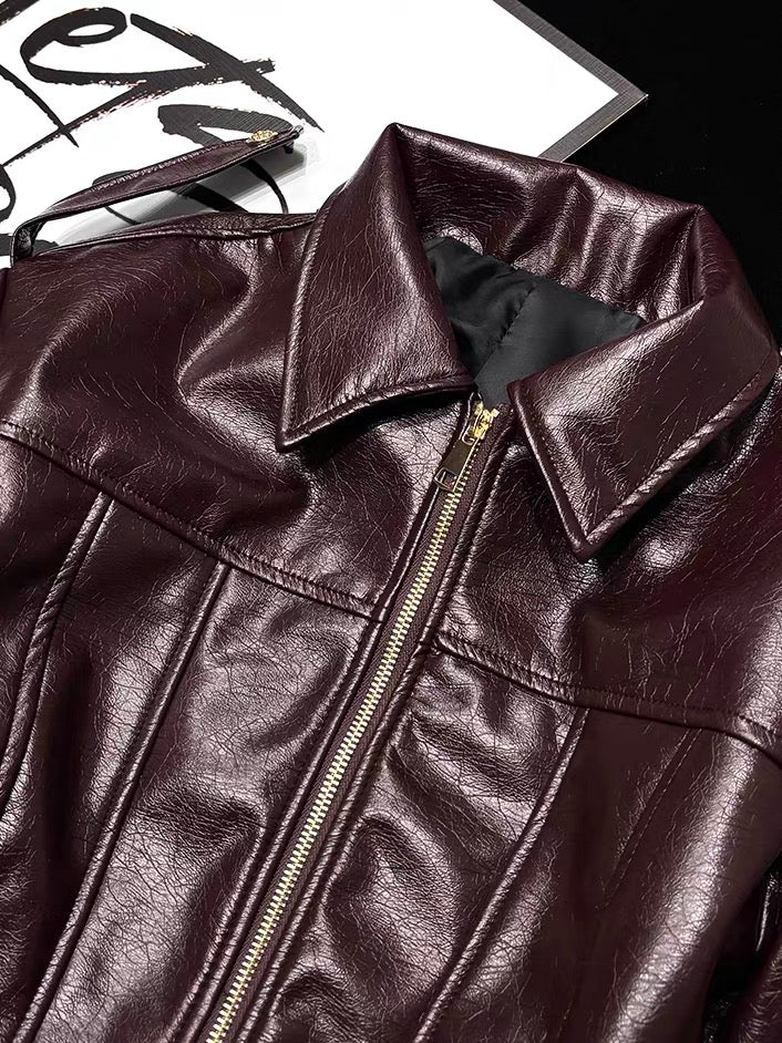 Burgundy faux leather moto jacket collar and gold zipper detail